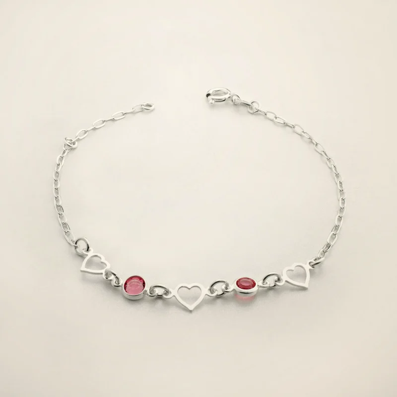 Bracciale Filo di Cuori — Catena sottile con cuori e pietre.